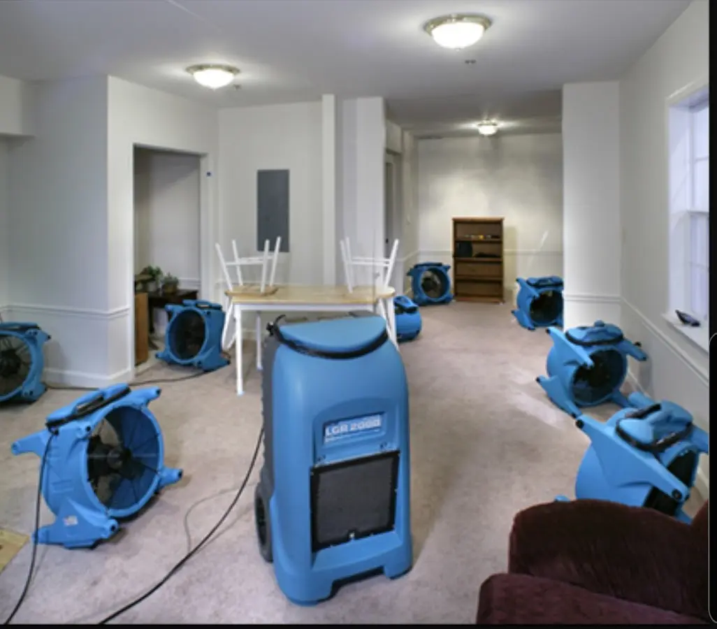 Air movers and dehumidifier setup for Water Damage Restoration in Winston